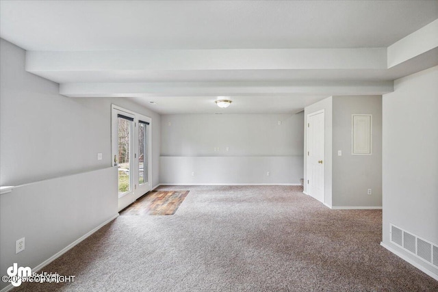 empty room with baseboards, carpet, and visible vents