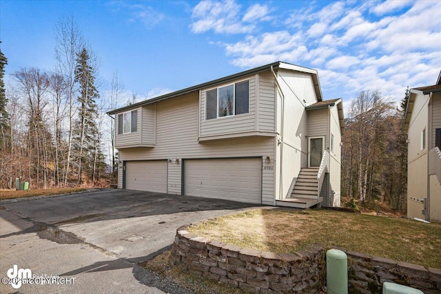 view of front facade with an attached garage and driveway