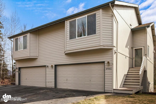 exterior space with a garage and driveway