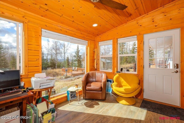 16500 E Smith Rd, Palmer, AK 99645 - living area with wood finished floors, ceiling fan, lofted ceiling, and wooden walls