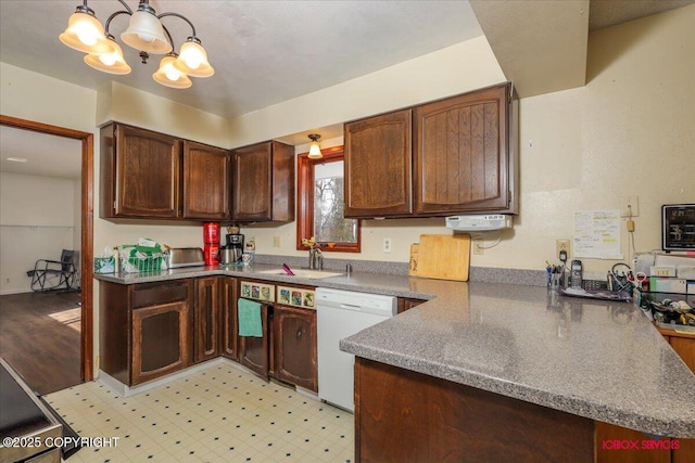 16500 E Smith Rd, Palmer, AK 99645 - kitchen featuring white dishwasher, a sink, a peninsula, an inviting chandelier, and light floors