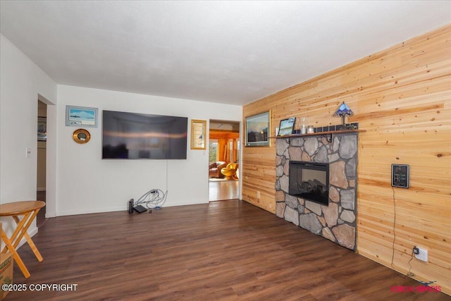 16500 E Smith Rd, Palmer, AK 99645 - living area featuring wooden walls, a fireplace, and wood finished floors