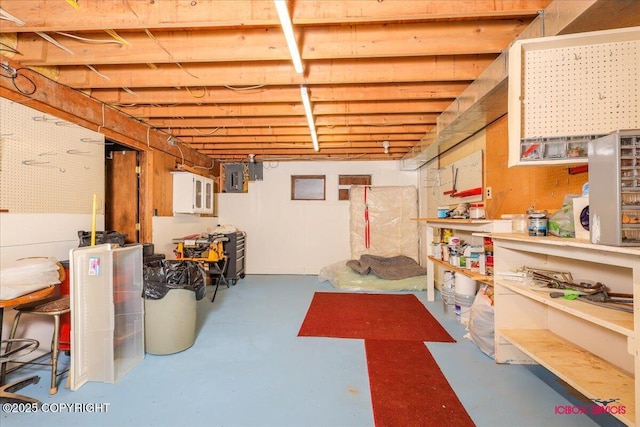 16500 E Smith Rd, Palmer, AK 99645 - unfinished basement featuring a workshop area and electric panel