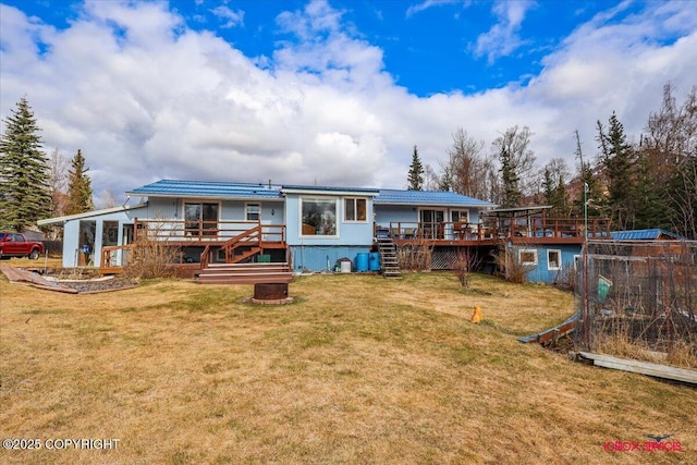 16500 E Smith Rd, Palmer, AK 99645 - rear view of house featuring a lawn, a deck, and stairs