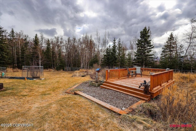 16500 E Smith Rd, Palmer, AK 99645 - wooden deck with a yard and a wooded view