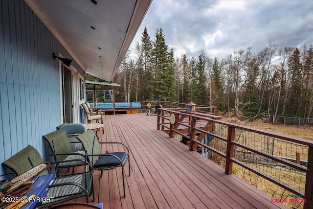 16500 E Smith Rd, Palmer, AK 99645 - wooden terrace with a forest view