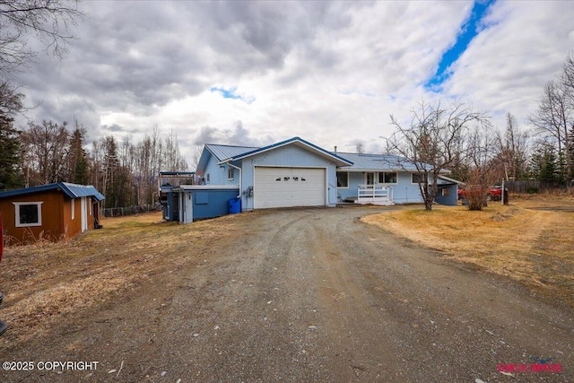 16500 E Smith Rd, Palmer, AK 99645 - ranch-style house featuring metal roof, a garage, driveway, and covered porch