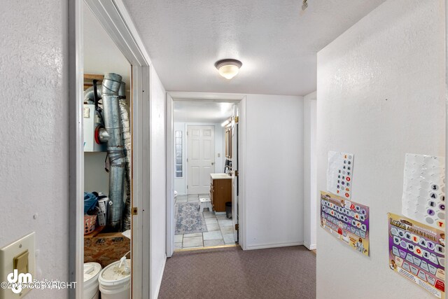 65265 Knob Hill Rd, Anchor Point, AK 99556 - hallway with a textured wall, carpet flooring, and a textured ceiling