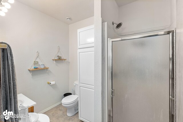 65265 Knob Hill Rd, Anchor Point, AK 99556 - full bathroom with a shower stall, tile patterned floors, baseboards, and toilet