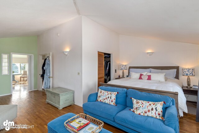 65265 Knob Hill Rd, Anchor Point, AK 99556 - bedroom with wood finished floors, baseboards, a closet, and vaulted ceiling