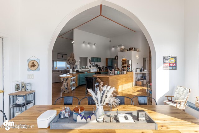 65265 Knob Hill Rd, Anchor Point, AK 99556 - dining room featuring arched walkways and wood finished floors