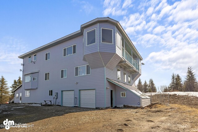 65265 Knob Hill Rd, Anchor Point, AK 99556 - back of house with driveway and a garage