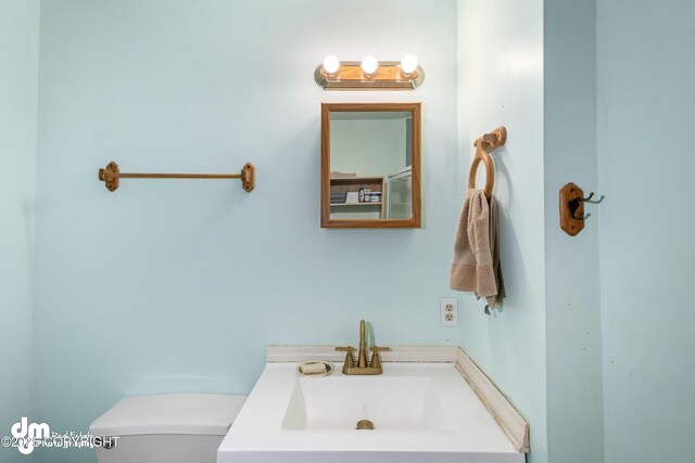65265 Knob Hill Rd, Anchor Point, AK 99556 - bathroom featuring toilet and vanity