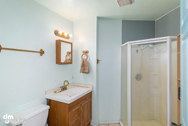 65265 Knob Hill Rd, Anchor Point, AK 99556 - bathroom featuring toilet, vanity, visible vents, and a stall shower
