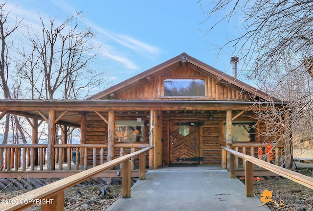 view of front of house with log exterior