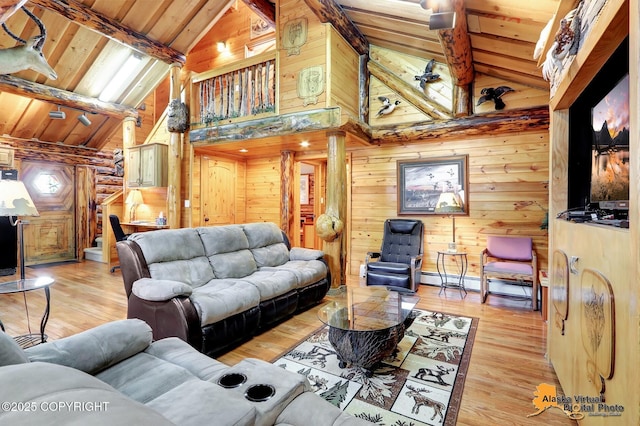 living room with high vaulted ceiling, light wood finished floors, wooden ceiling, and beam ceiling