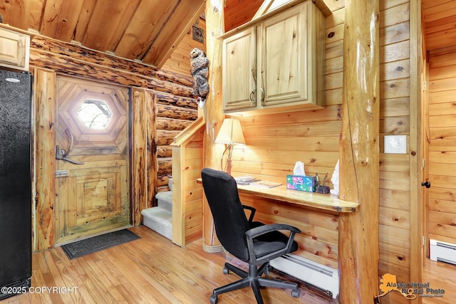 home office featuring baseboard heating, light wood-type flooring, wood walls, a baseboard radiator, and wooden ceiling