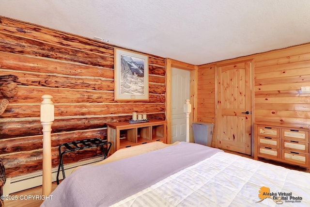 bedroom featuring rustic walls and wood finished floors