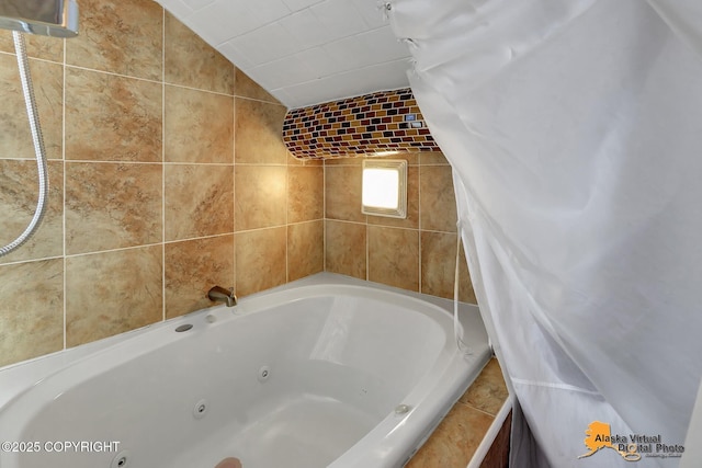 full bath with a jetted tub and vaulted ceiling