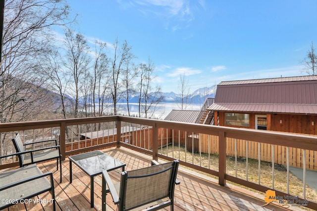 wooden deck featuring a mountain view