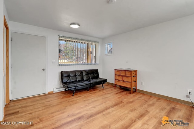 sitting room featuring light wood finished floors and baseboards