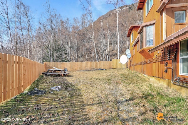 view of yard with a fenced backyard