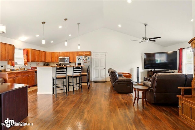3762-3768 S Lansing Rd, Wasilla, AK 99654 - living area with healthy amount of natural light, ceiling fan, high vaulted ceiling, dark wood-style floors, and recessed lighting