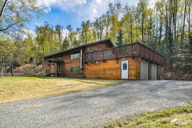 21440 Falling Water Cir, Eagle River, AK 99577 - view of front of property with a garage, a front yard, a deck, and gravel driveway