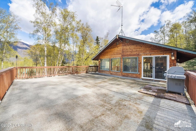 21440 Falling Water Cir, Eagle River, AK 99577 - view of patio with area for grilling and a mountain view