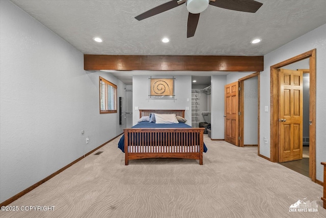 21440 Falling Water Cir, Eagle River, AK 99577 - bedroom with baseboards, recessed lighting, beam ceiling, a walk in closet, and light carpet