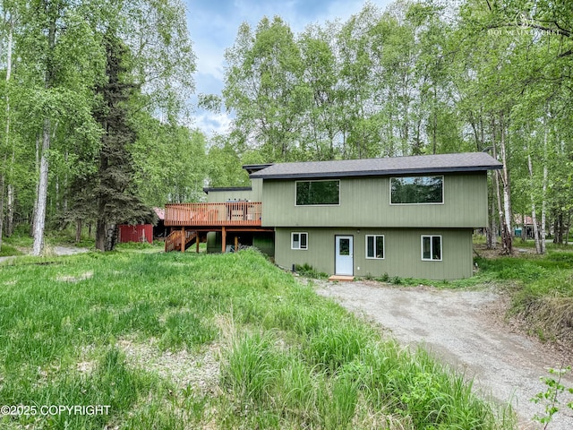 8747 S Twilight Dr, Wasilla, AK 99623 - back of house with a deck and driveway