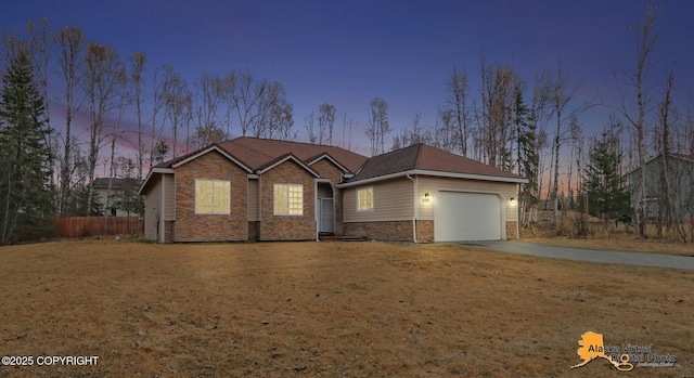 single story home with concrete driveway, stone siding, fence, and an attached garage