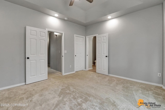 unfurnished bedroom featuring baseboards, carpet, and recessed lighting