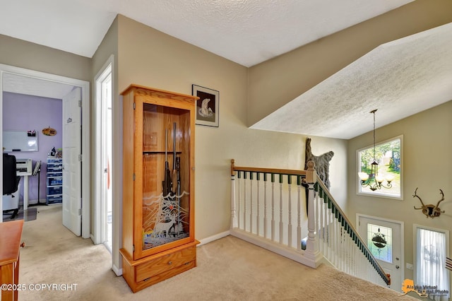 2500 Maylen Cir, Anchorage, AK 99516 - hall with an upstairs landing, carpet floors, a textured ceiling, and baseboards