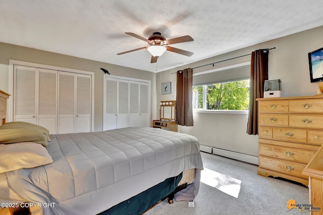 2500 Maylen Cir, Anchorage, AK 99516 - bedroom with a baseboard radiator, light carpet, ceiling fan, and two closets