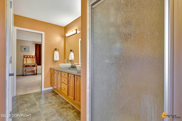 2500 Maylen Cir, Anchorage, AK 99516 - bathroom with double vanity, an enclosed shower, and baseboards