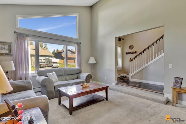 2500 Maylen Cir, Anchorage, AK 99516 - living room with a towering ceiling, baseboard heating, stairs, baseboards, and carpet