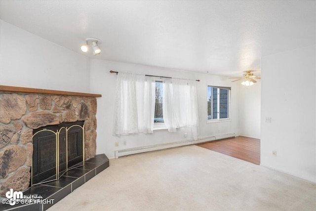 315 Krane Dr # 19, Anchorage, AK 99504 - unfurnished living room featuring baseboard heating, carpet flooring, a fireplace, and a ceiling fan
