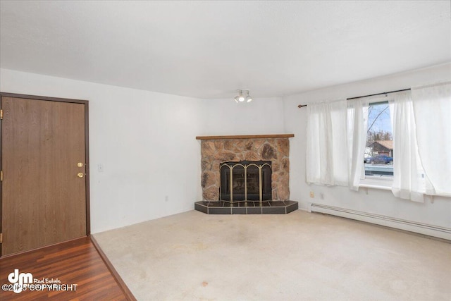 315 Krane Dr # 19, Anchorage, AK 99504 - unfurnished living room with a baseboard heating unit and a fireplace
