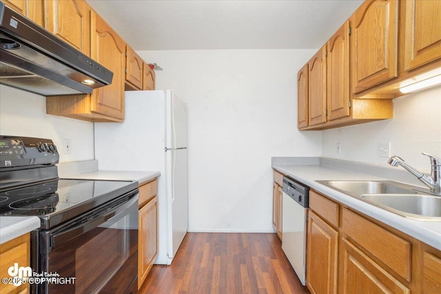 315 Krane Dr # 19, Anchorage, AK 99504 - kitchen featuring under cabinet range hood, stainless steel dishwasher, a sink, black range with electric cooktop, and dark wood-style flooring