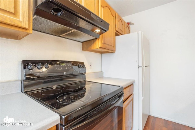 315 Krane Dr # 19, Anchorage, AK 99504 - kitchen featuring black electric range oven, light countertops, under cabinet range hood, and dark wood-style floors
