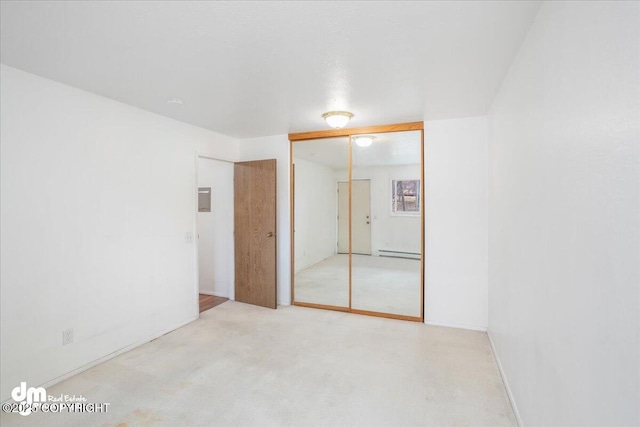 315 Krane Dr # 19, Anchorage, AK 99504 - unfurnished bedroom featuring baseboard heating and a closet