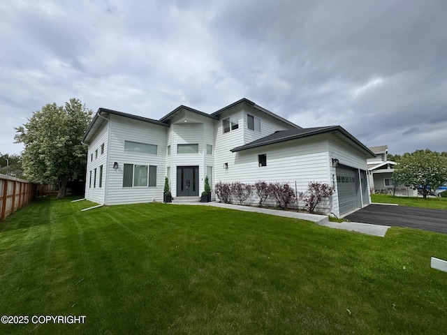 7512 Setter Dr, Anchorage, AK 99502 - contemporary home with driveway and an attached garage