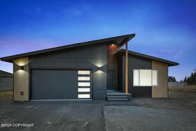 1029 Shelley Ave, Homer, AK 99603 - contemporary home featuring an attached garage and asphalt driveway