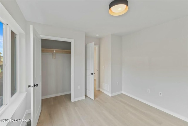 1029 Shelley Ave, Homer, AK 99603 - unfurnished bedroom featuring light wood-style flooring and a closet