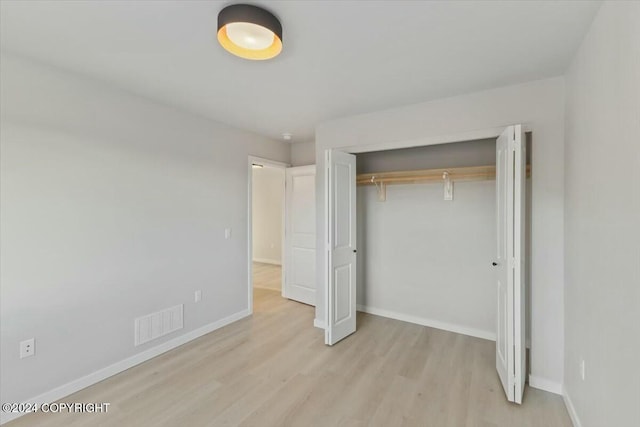 1029 Shelley Ave, Homer, AK 99603 - unfurnished bedroom featuring a closet and light wood finished floors