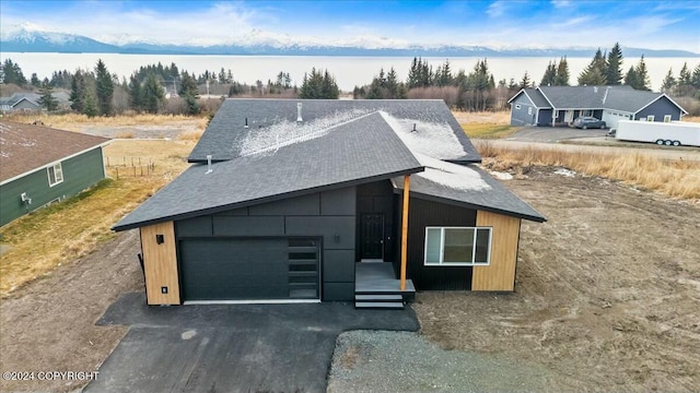 1029 Shelley Ave, Homer, AK 99603 - view of front of property featuring asphalt driveway, an attached garage, and roof with shingles