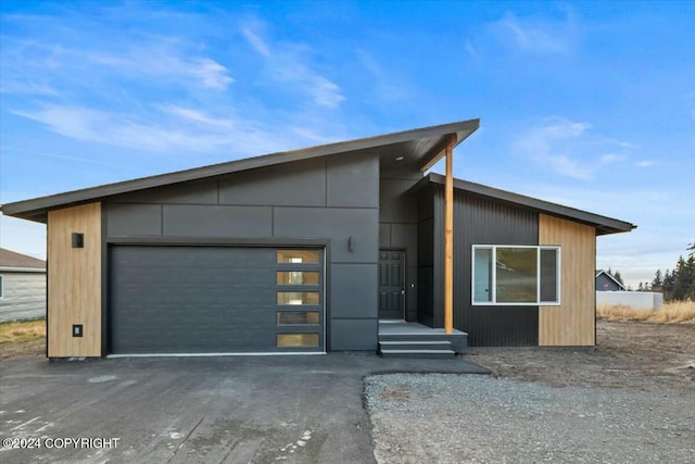 1029 Shelley Ave, Homer, AK 99603 - modern home with asphalt driveway and a garage