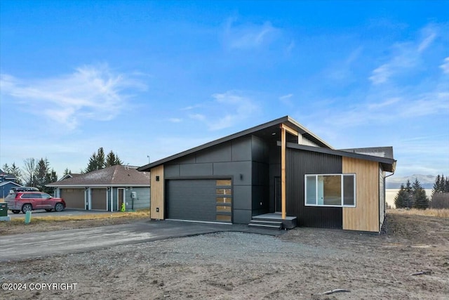1029 Shelley Ave, Homer, AK 99603 - contemporary home with an attached garage and asphalt driveway