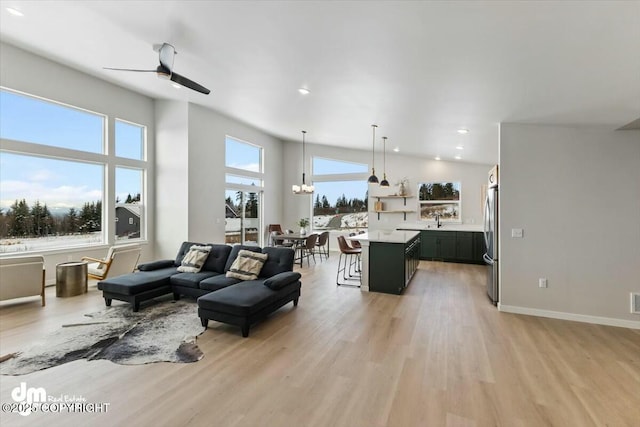 1029 Shelley Ave, Homer, AK 99603 - living area featuring light wood finished floors, ceiling fan, recessed lighting, and lofted ceiling